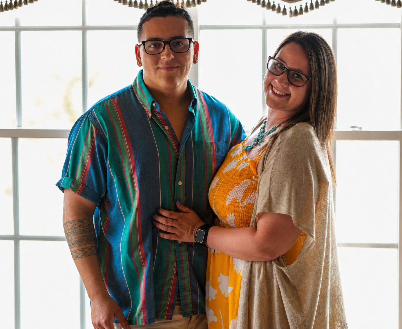 Julian and Elizabeth smiling together indoors