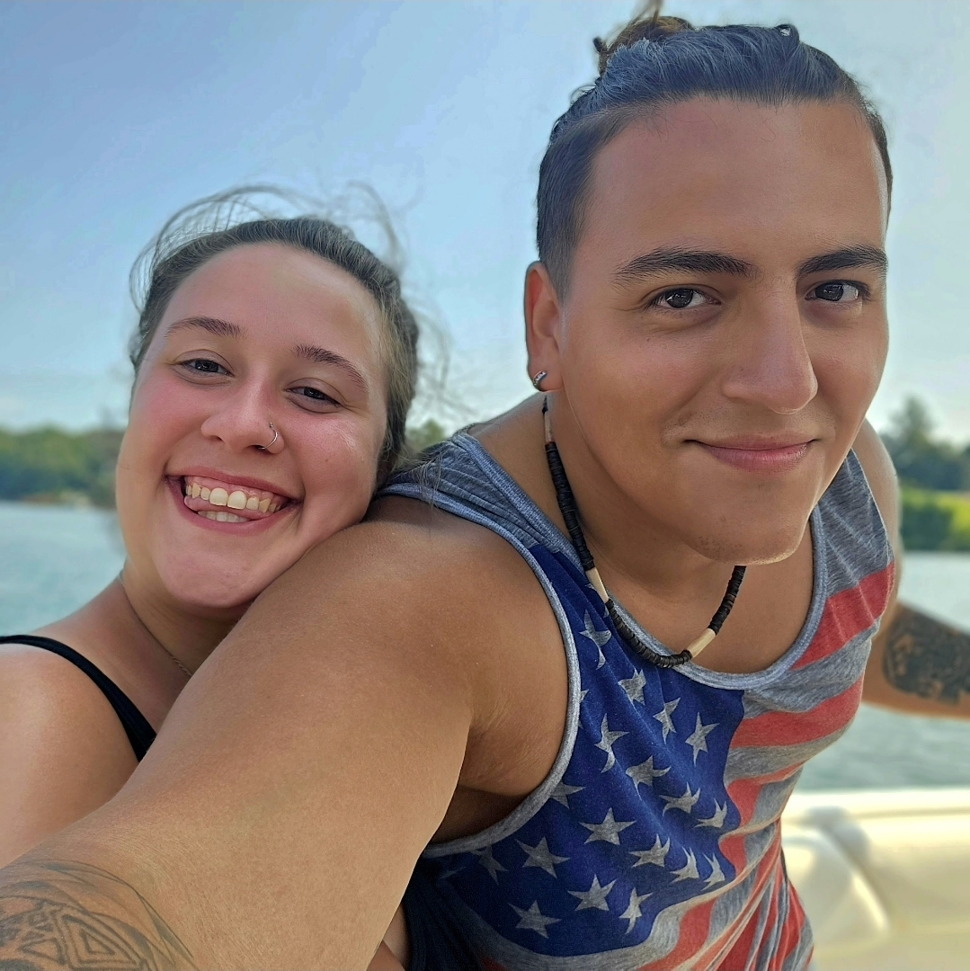 Julian and Elizabeth smiling on the water